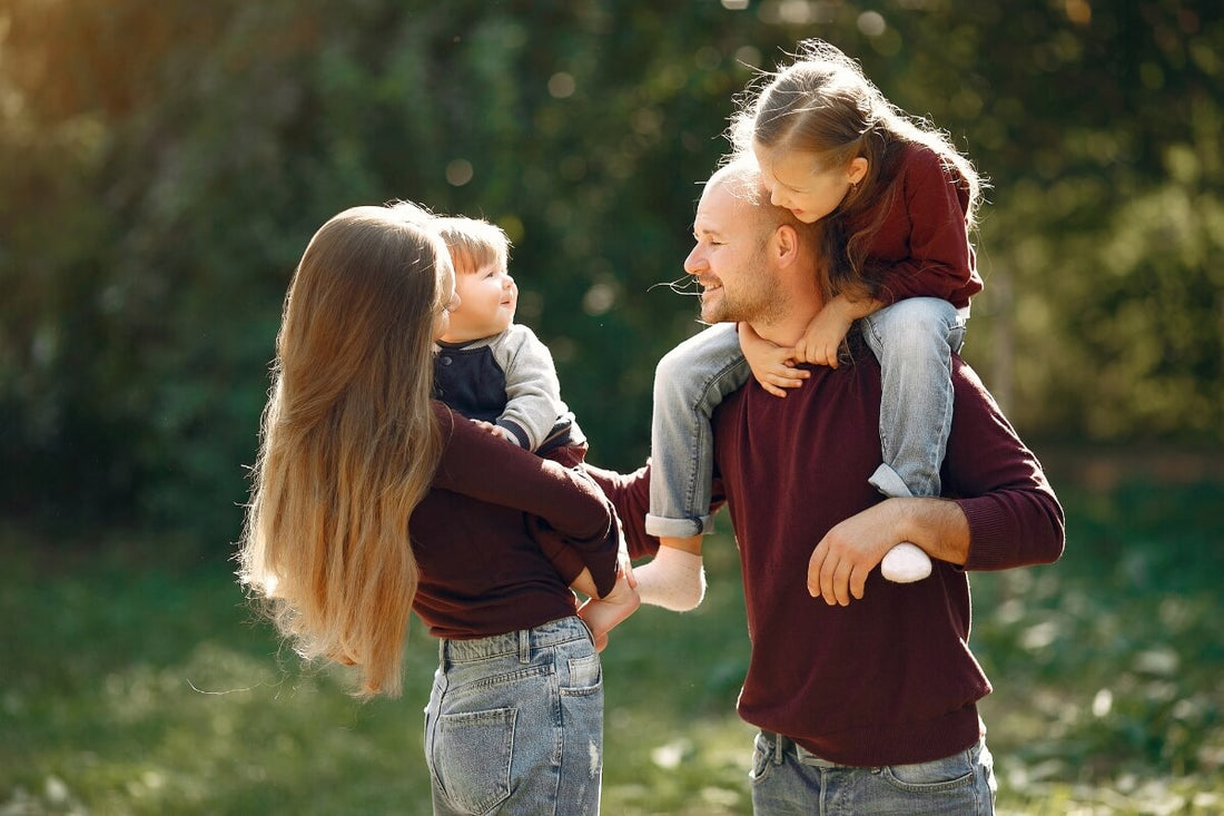 Happy family enjoying outdoors time in a park.