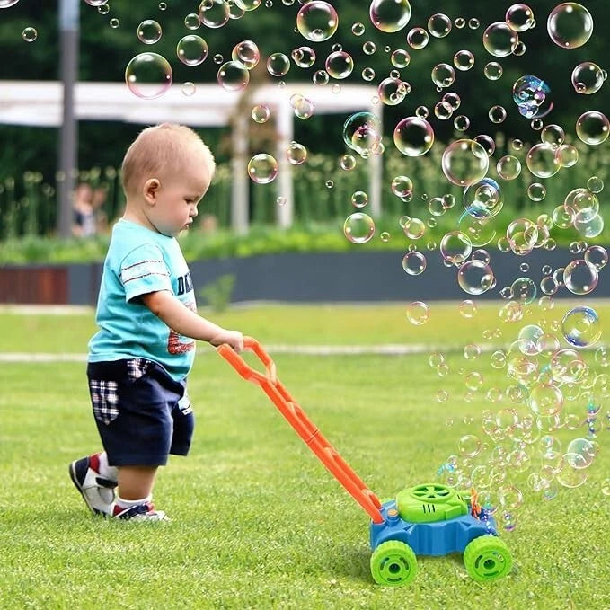 Baby playing with a Bubble Mowing Pro toy in the backyard.