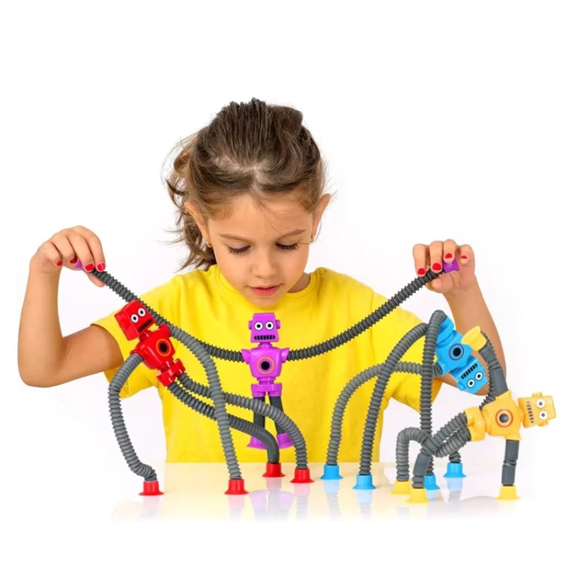 Child playing with FlexiBots which come in four colors and have expandable arms and legs with suction cups.