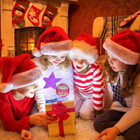 Children unboxing the Galactic Flying Spinner toy which is hovering above the gift box.