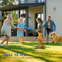 Family of four and their dog playing with a flying orb toy in the backyard. 
