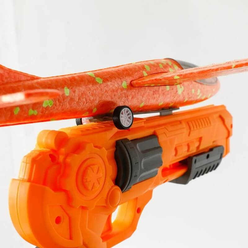 Jet Blaster toy featuring a plastic gun that launches a foam airplane.