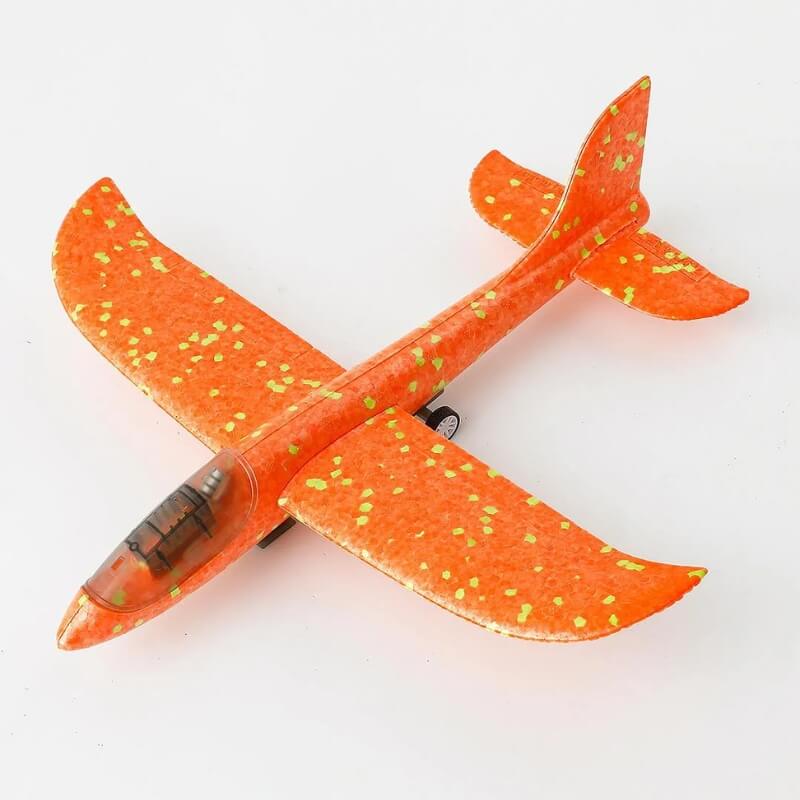 Foam airplane with LED lights and plastic wheels.