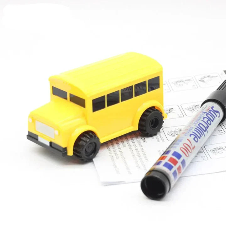 Trace Racers Bus toy close up, with a black marker next to it, and a manual. 