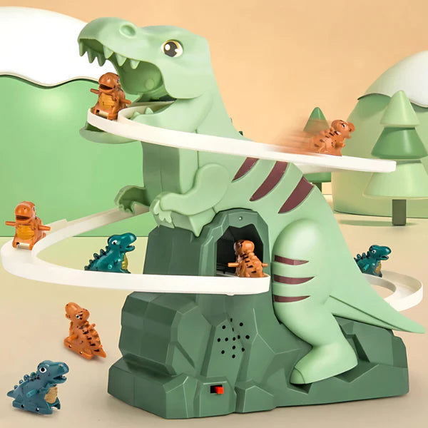Motorized dinosaur slide toy featuring a green T-Rex with winding tracks and small dinosaur figures that slide down. Set in a playful prehistoric landscape with trees and hills in the background.