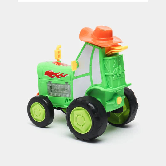 Green Tumble Tractor toy featuring lights, music, and dancing. 