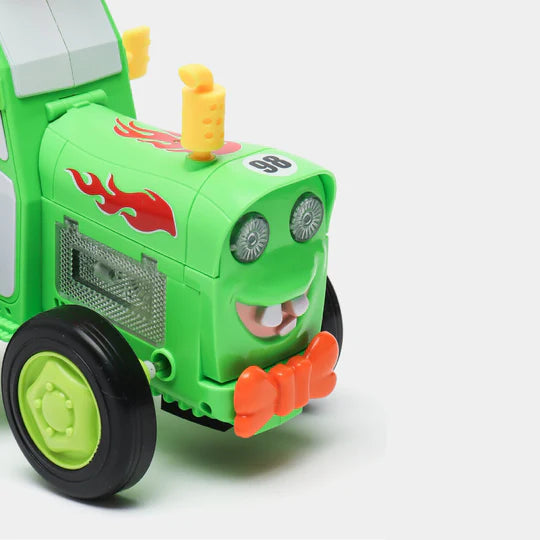 Close up on the front of Tumble Tractor showing mouth, LED eyes, and a red ribbon tie. 