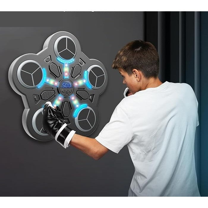 Boy playing on a hit the beat game.