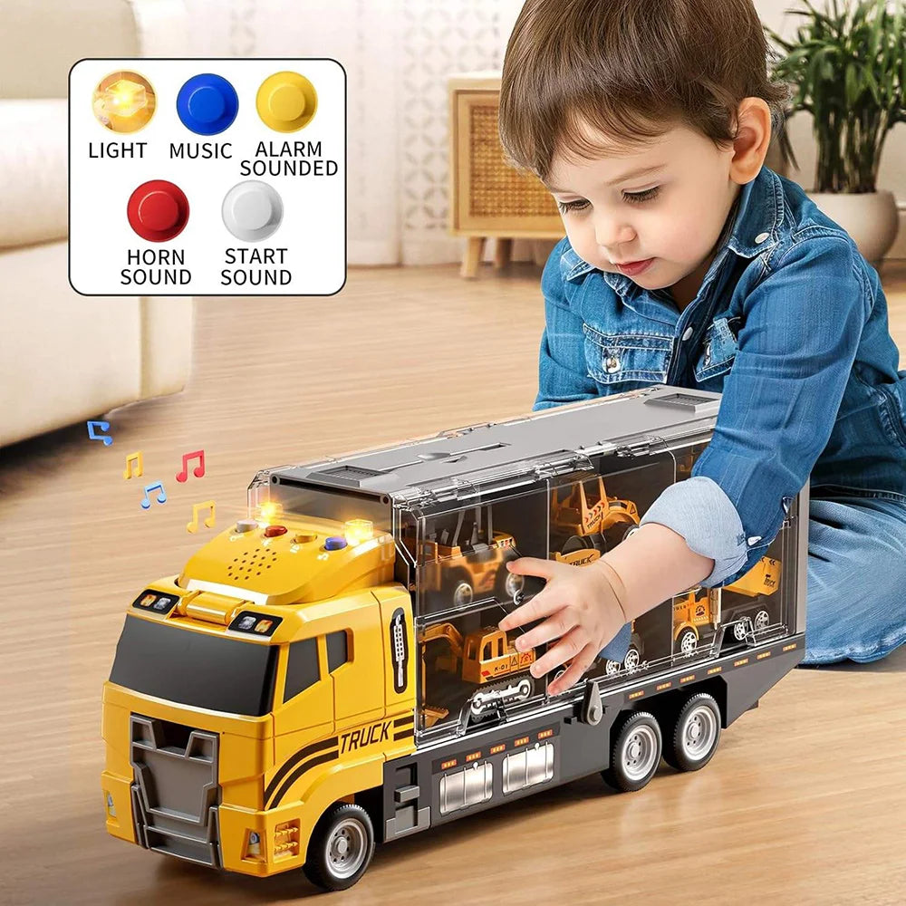 Little boy playing with a yellow Mega Construction Truck toy with lights, music, horns, and alarm buttons.